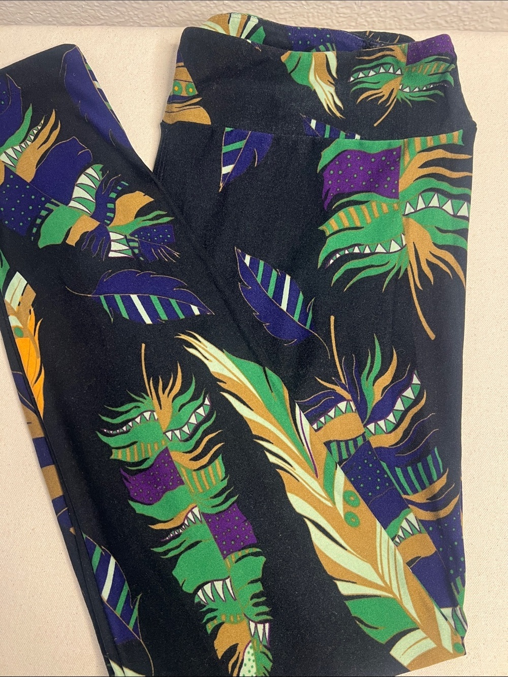 LuLaRoe Black Feather Print Leggings with Green, Purple & Gold Accents